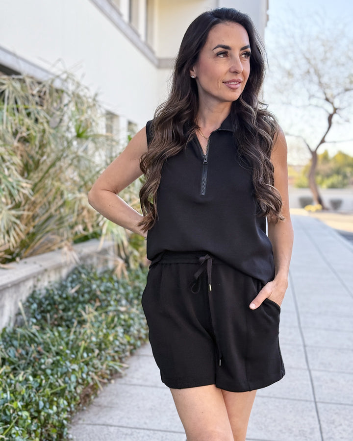 Woman in black outfit