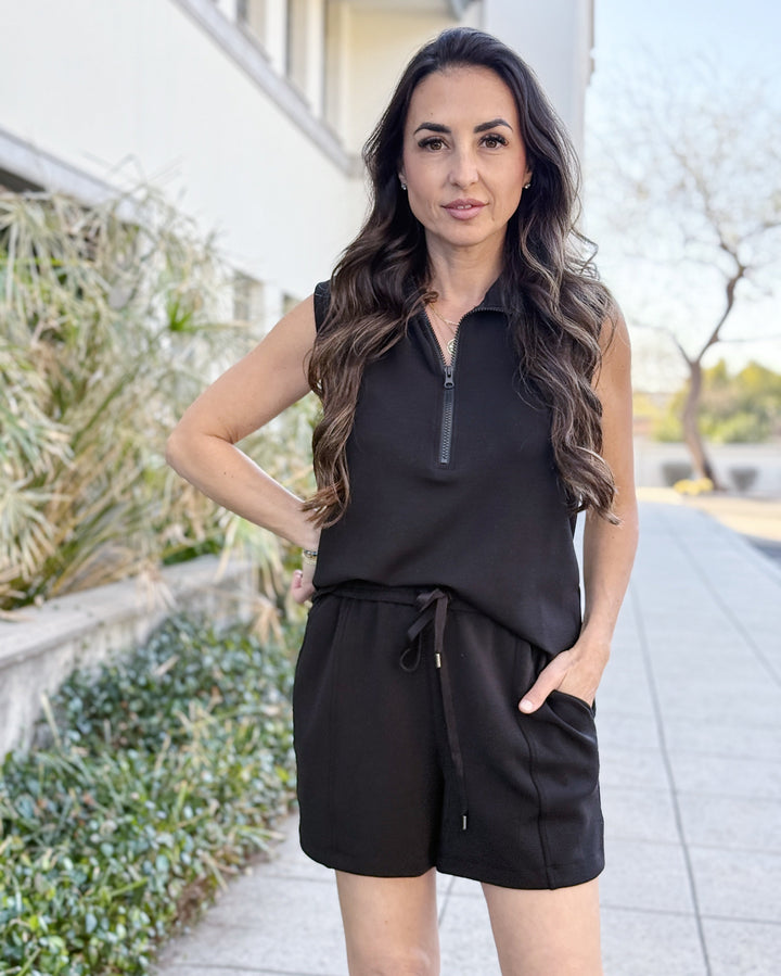 Woman in black outfit