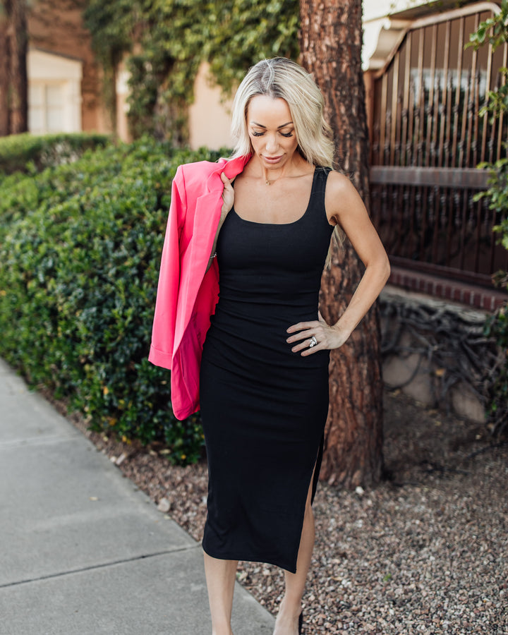 Black sleeveless dress with pink blazer for a modern look at Shop Klio