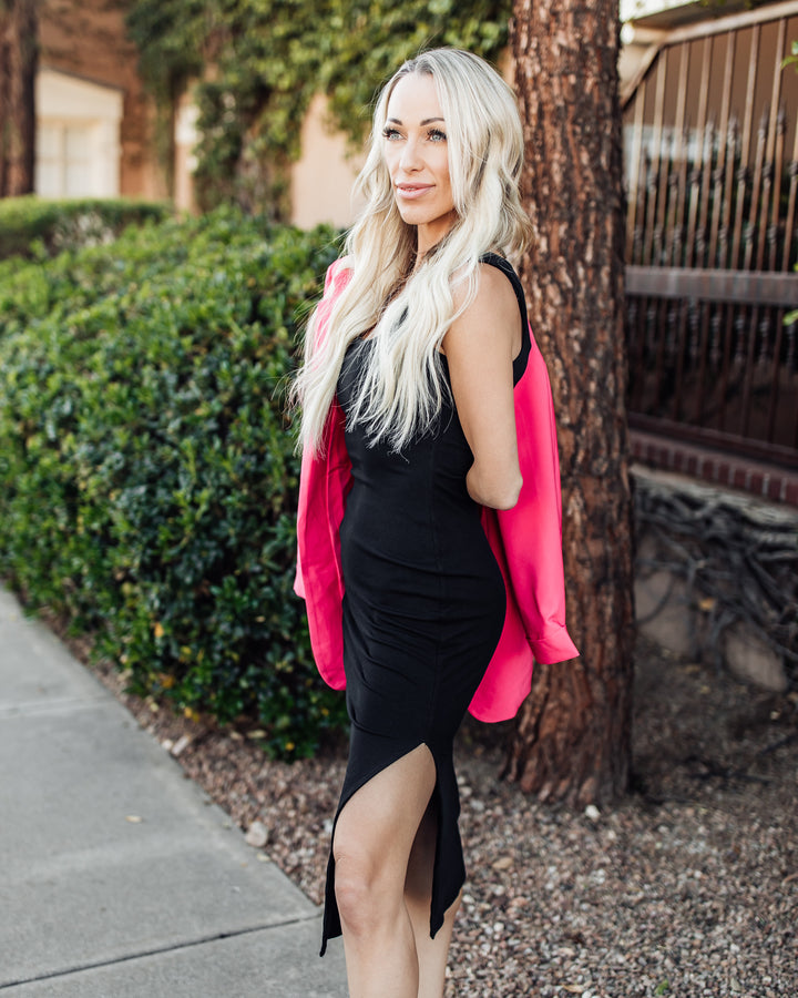 Black dress with a stylish pink blazer
