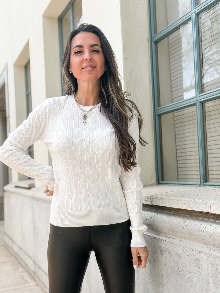 The Round Neck Cable Knit Long Sleeved Sweater