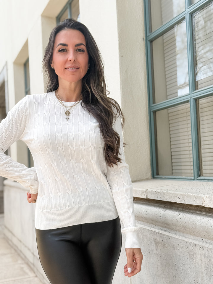 The Round Neck Cable Knit Long Sleeved Sweater