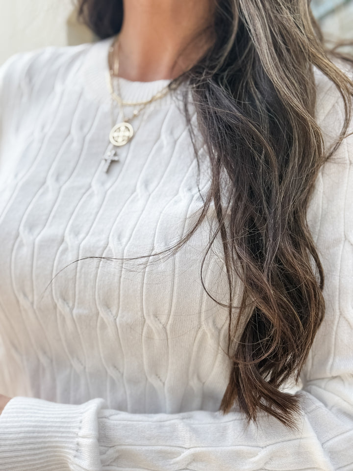 The Round Neck Cable Knit Long Sleeved Sweater