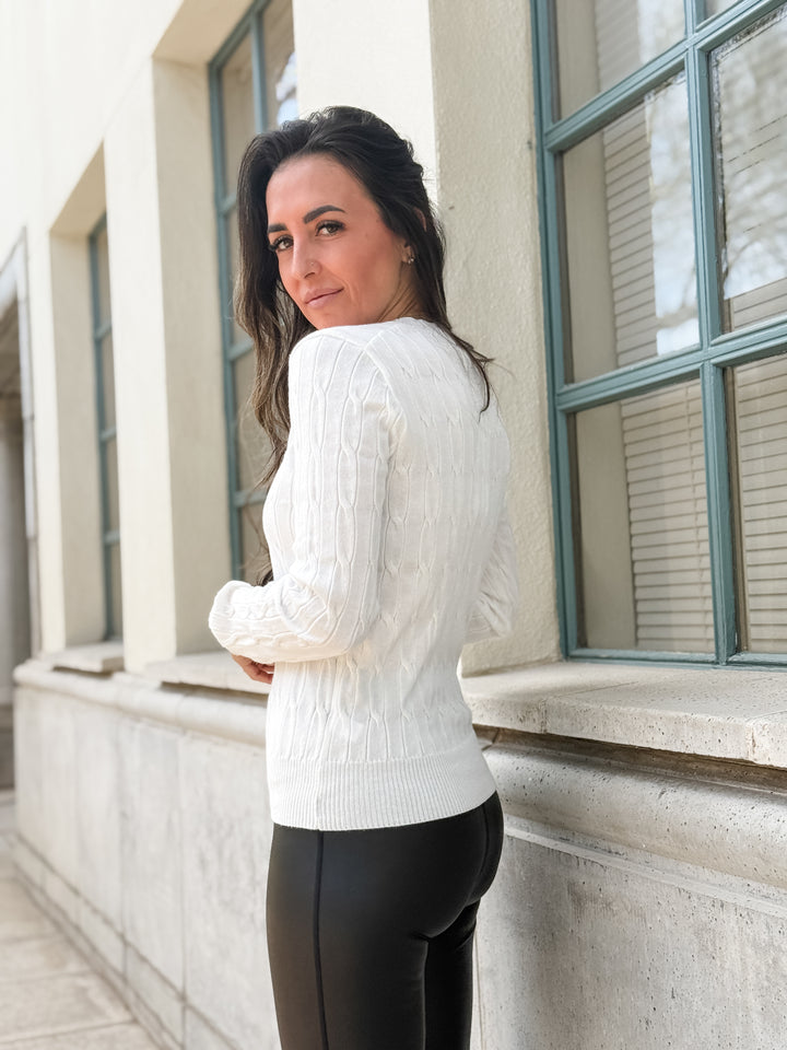 The Round Neck Cable Knit Long Sleeved Sweater