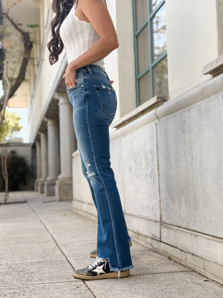 Casual blue jeans, ripped, frayed hem