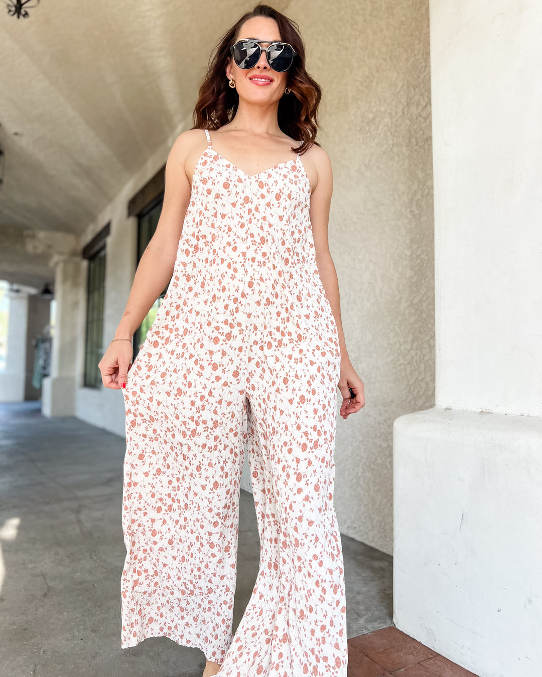 The Calista Pleated Jumpsuit – Cream Floral