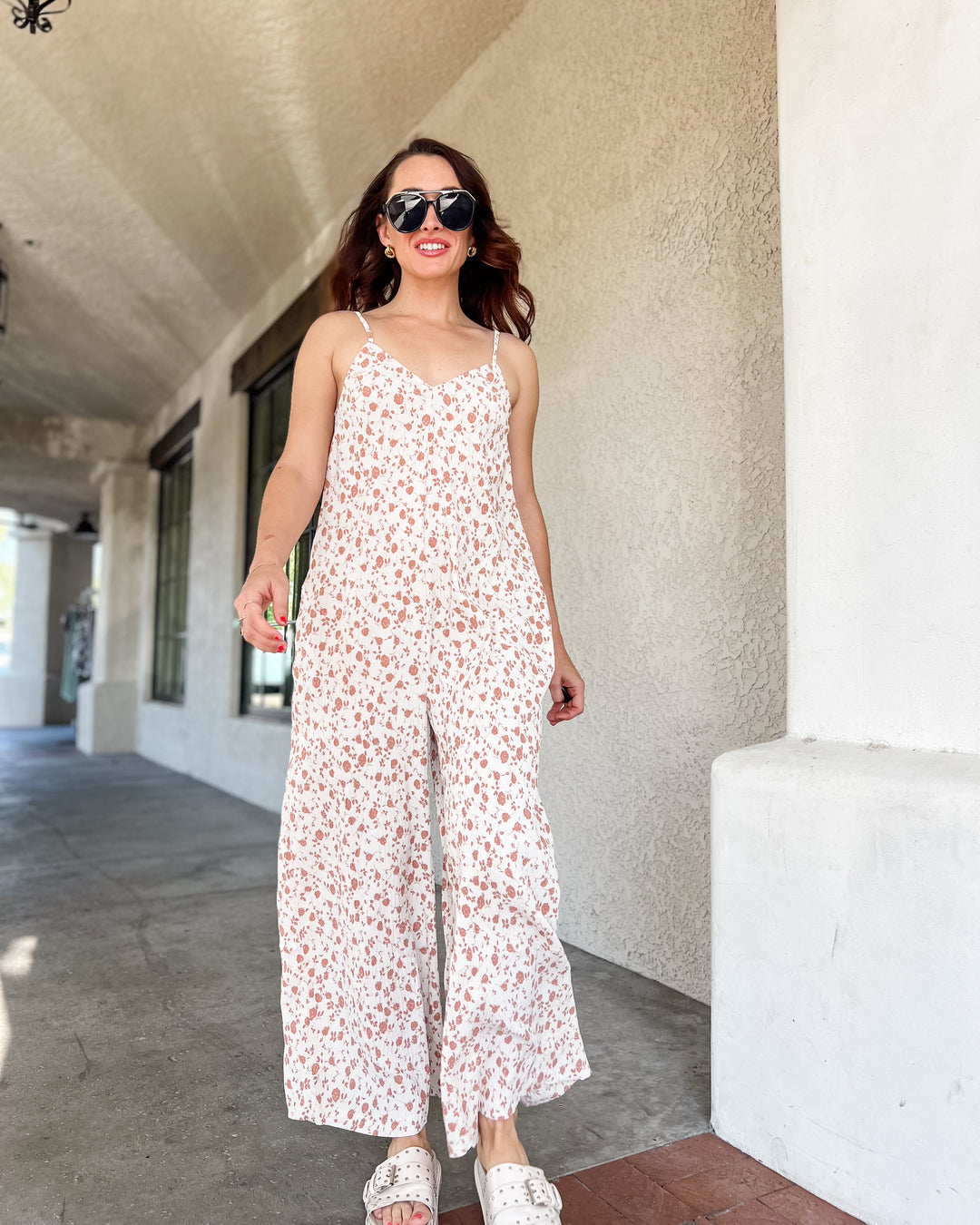 The Calista Pleated Jumpsuit – Cream Floral